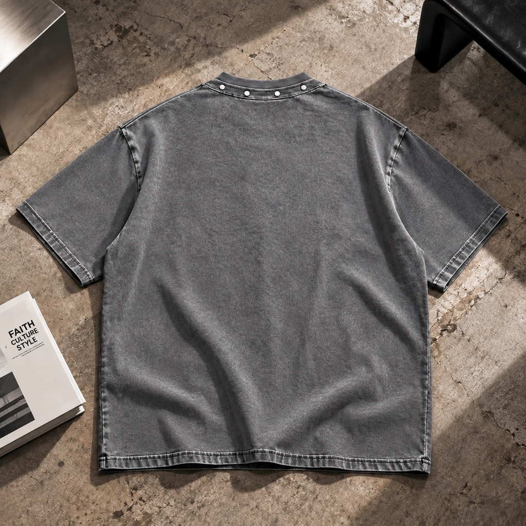 Back view of HLY WTR washed grey oversized T-shirt with studded collar